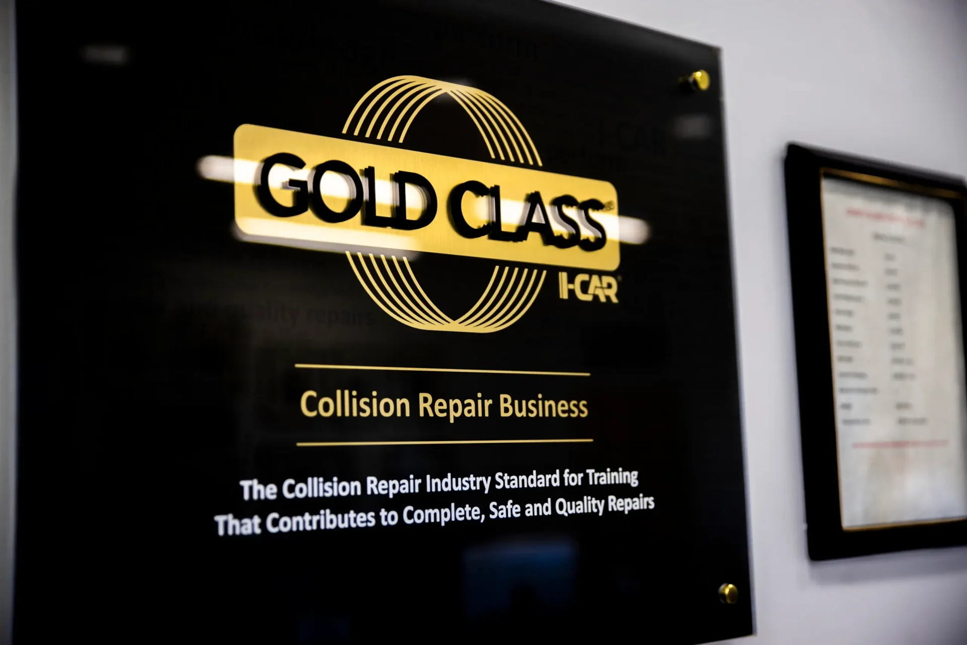 I-CAR Gold Class Certification plaque hanging at Covert Collision Center in Austin, TX